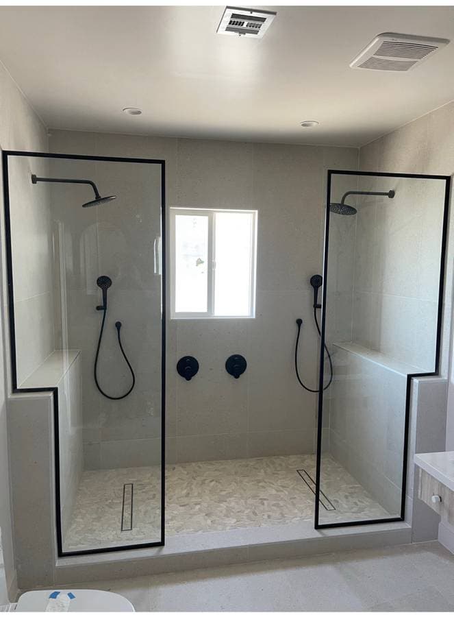 picture of a custom open air dual luxury shower with custom tiling